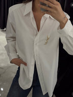 White shirt with brooch
