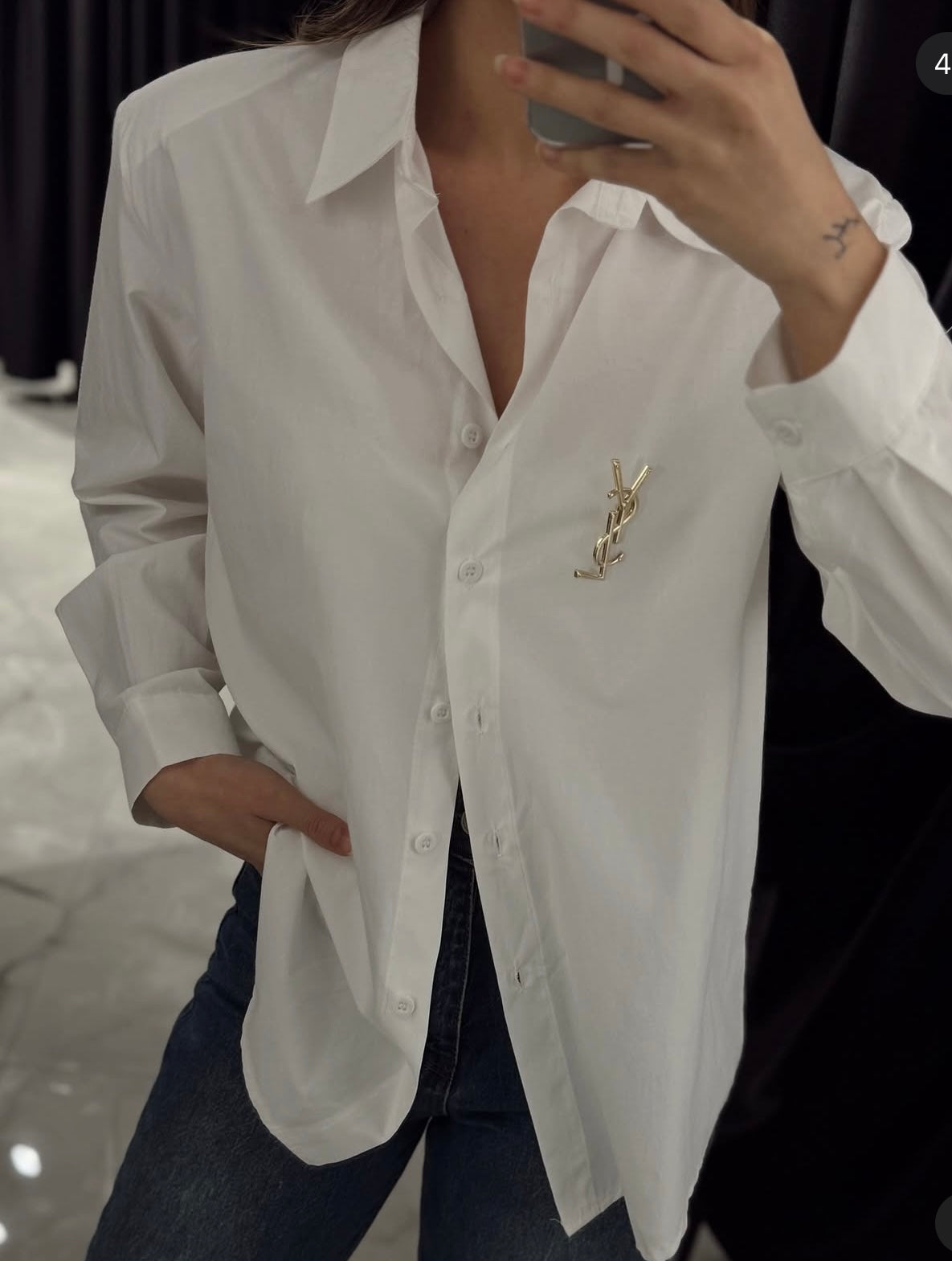 White shirt with brooch