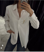 White shirt with brooch